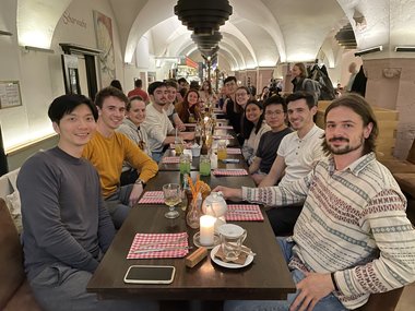 Group picture taken at the dinner table