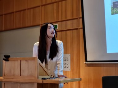 Chloe Huang from the Croucher Foundation presents her research. She is taking a look at her slides.