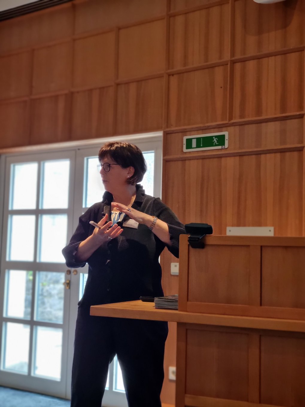 MtL Fellow Karin Jacobs gestures with both hands while explaining a concept during her lecture.