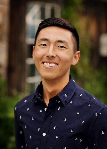 Portrait photo of Kueyoung in a natural outdoor setting
