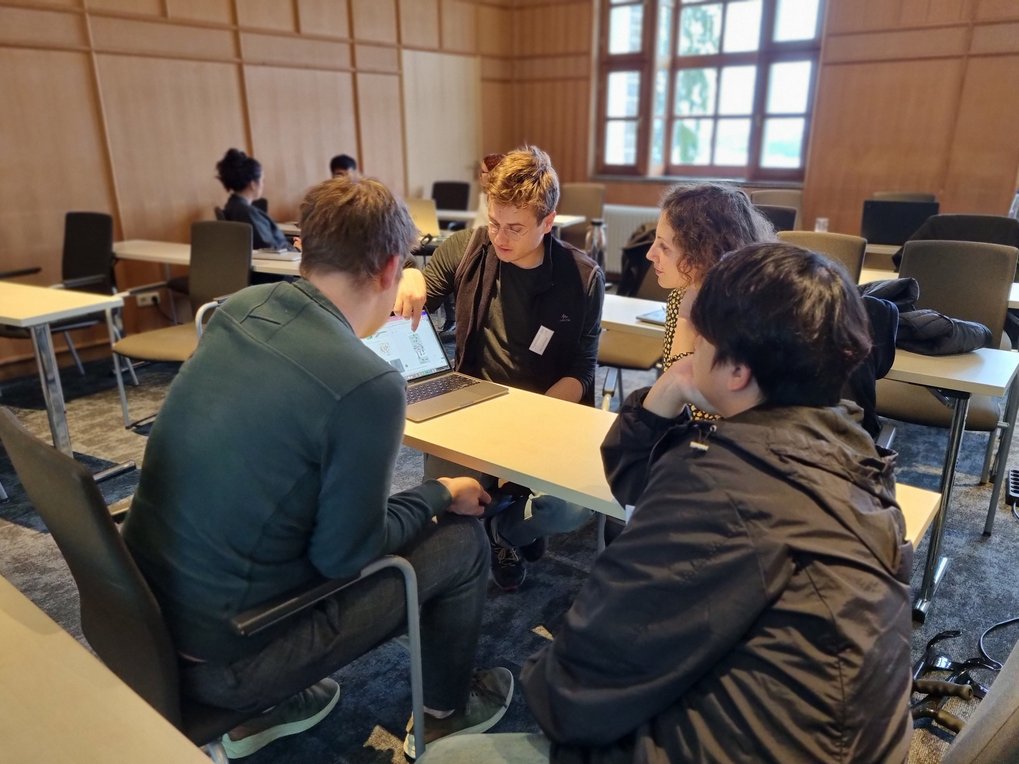 Another group discusses their selected toy project