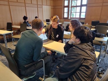 Another group discusses their selected toy project