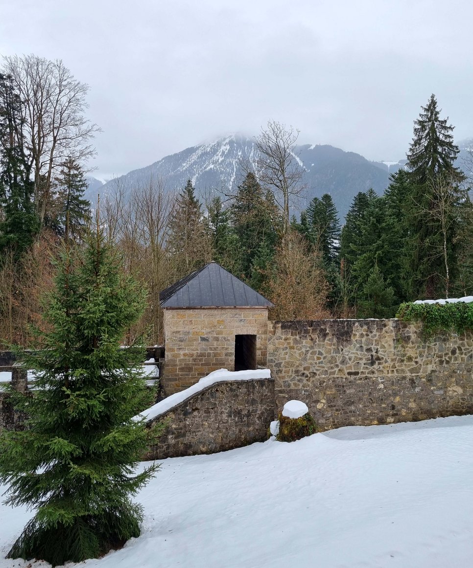 Castle wall of Ringberg Castle, in a snowy mountain landscape