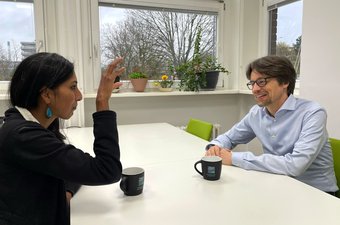 Thorsten Moos and Dharanija Madhavan had an engaging conversation on the role of ethics in Matter to Life. Matter to Life Fellow Thorsten Moos and Matter to Life coordinator Dharanija Madhavan sit at a table and have a conversation.