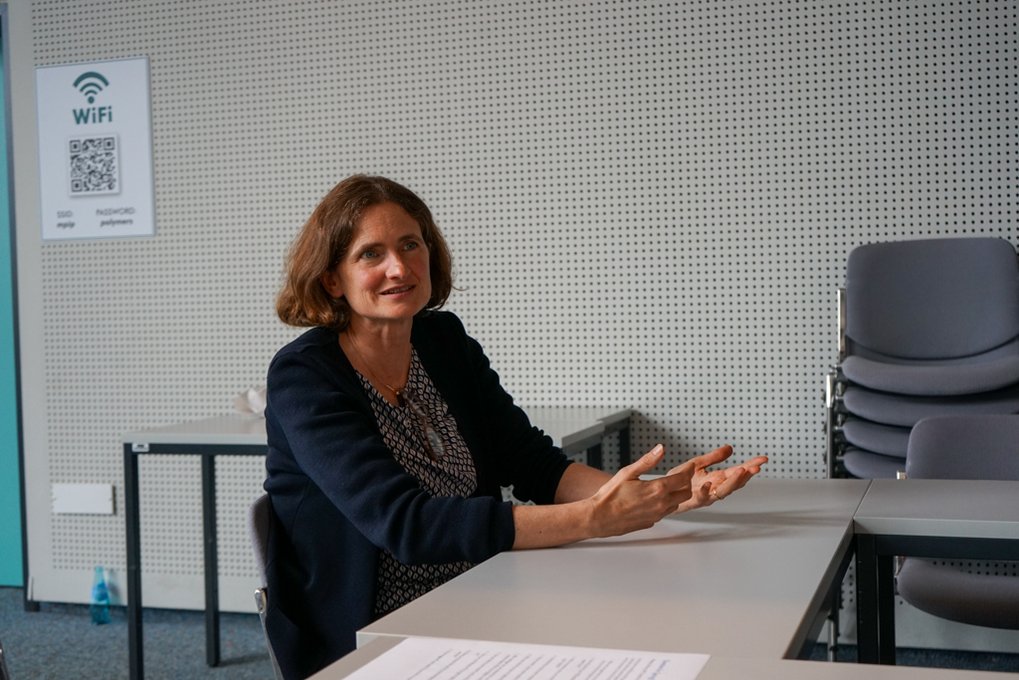 Matter to Life Fellow Tanja Weil sitting at a table, communicating