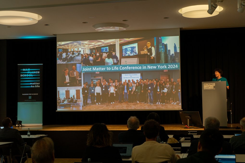 Speaker presenting at the Joint Matter to Life Conference 2024 with audience seated and a collage of conference images displayed.
