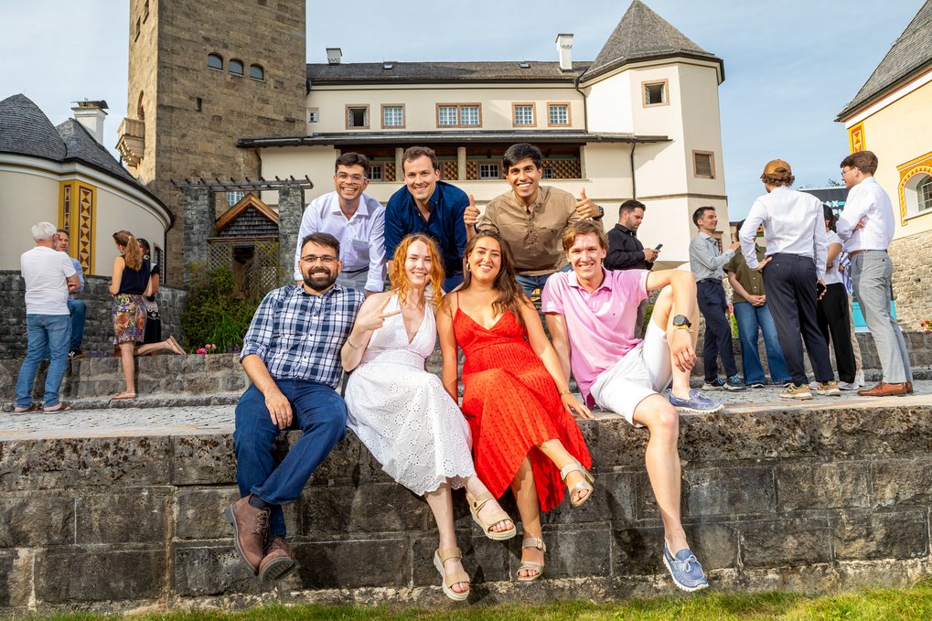 Group of young adults posing outdoors in front of castle Ringberg
